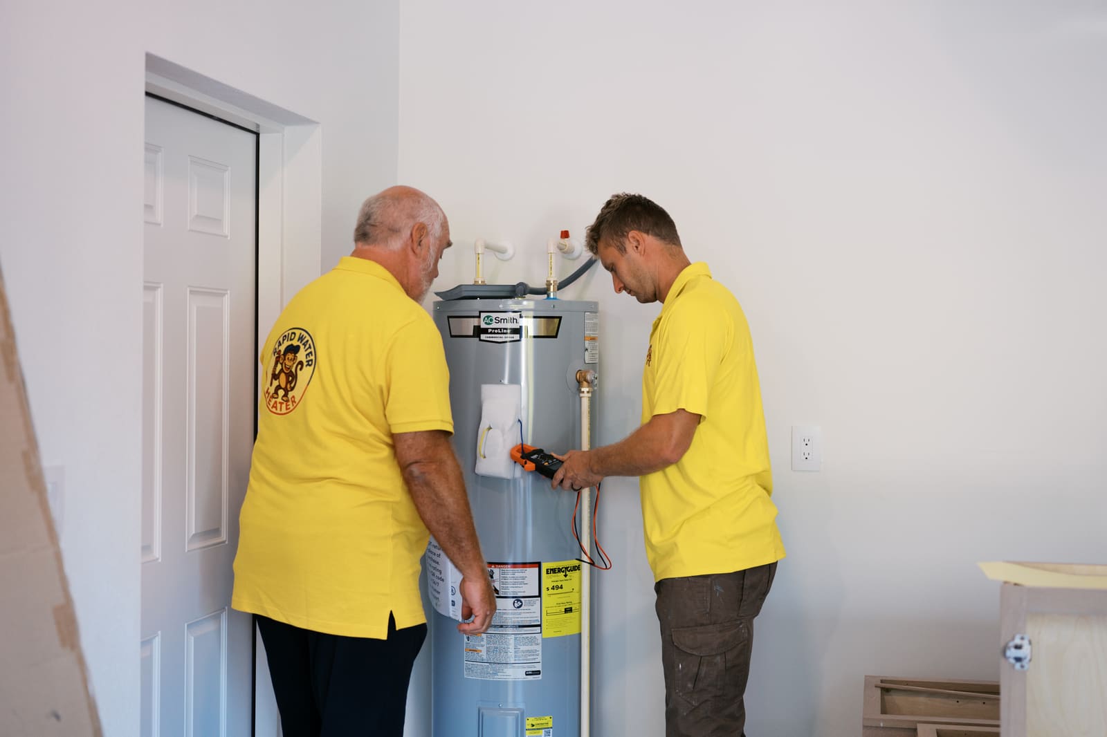 Josh and Pat of Rapid Water Heater checking a newly installed water heater